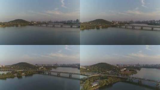 航拍武汉东湖桥车流山丘高清在线视频素材下载