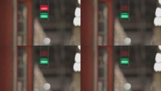 模糊火车站背景中红色和绿色信号灯的特写高清在线视频素材下载