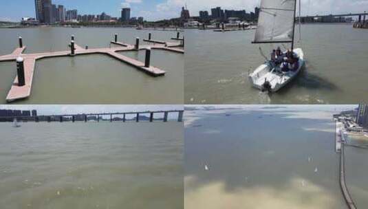 航拍广州南沙游艇会的帆船出海高清在线视频素材下载
