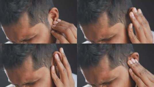 耳朵痛的年轻人触摸他疼痛的耳朵高清在线视频素材下载