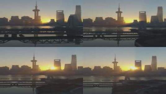 日出时的上海天际线和外白渡桥向后飞翔鸟瞰高清在线视频素材下载