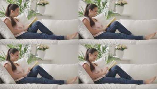 女人躺在沙发上阅读高清在线视频素材下载