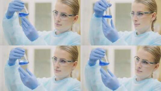 女科学家用玻璃器皿在实验室分析液体高清在线视频素材下载