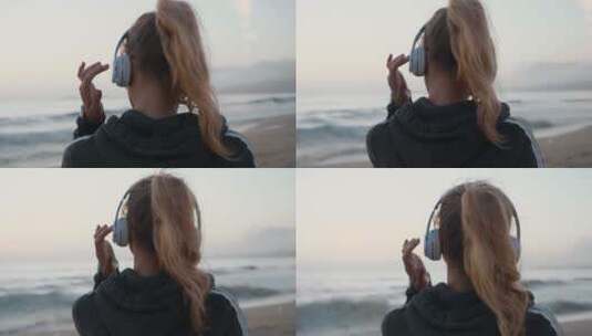 女孩吹着海风听着音乐高清在线视频素材下载