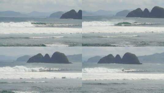 冲浪者冲浪的后面有座小岛高清在线视频素材下载