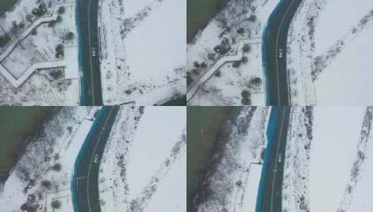 航拍雪景中奔驰的汽车高清在线视频素材下载