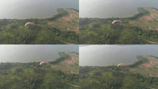 武汉滑翔伞基地航拍湖畔绿地飞翔的过程709高清在线视频素材下载