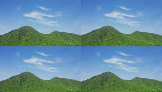 蓝天下的山被生机盎然的绿植覆盖高清在线视频素材下载