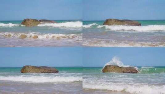 海边一块巨大的礁石被海浪冲刷慢镜头高清在线视频素材下载
