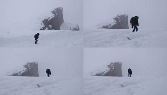 登山者风雪中孤独行走徒步攀登高清在线视频素材下载