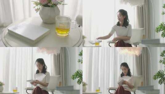 优雅女人喝茶看书高清在线视频素材下载
