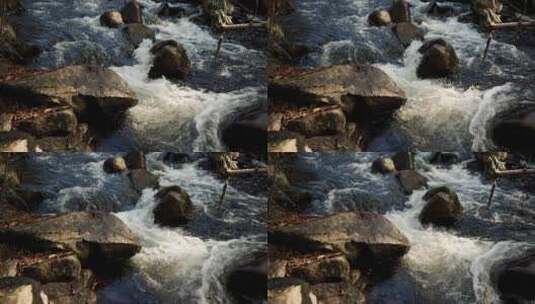 魁北克圣科姆溜槽公牛公园山间徒步旅行中巨石上的强劲流动河流高清在线视频素材下载
