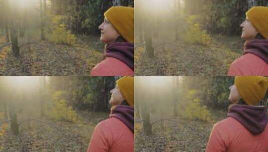 日落时女子在森林中漫步高清在线视频素材下载