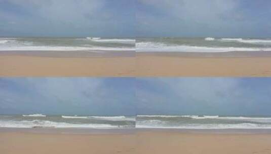 沙滩上的波浪和白色泡沫高清在线视频素材下载