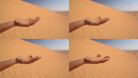 沙漠的沙子单手穿过手指高清在线视频素材下载