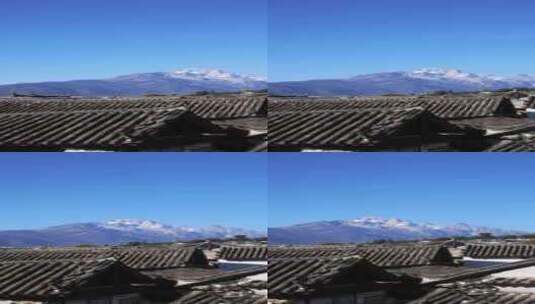 在丽江古城屋顶眺望远处的玉龙雪山竖屏高清在线视频素材下载