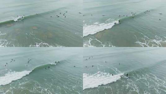 海南万宁石梅湾冲浪爱好者追浪高清在线视频素材下载