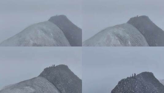 航拍登顶岷山山脉主峰雪宝顶雪山的登山者高清在线视频素材下载