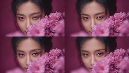 东方女性的神秘面纱与粉色花朵的温柔相遇高清在线视频素材下载