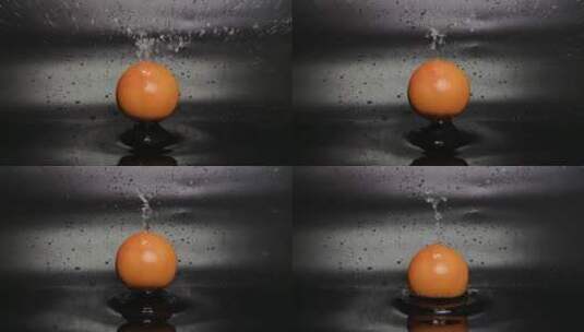 慢镜头拍摄水果西柚落水瞬间高清在线视频素材下载