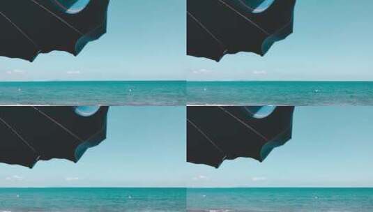 遮阳伞下拍摄海洋高清在线视频素材下载