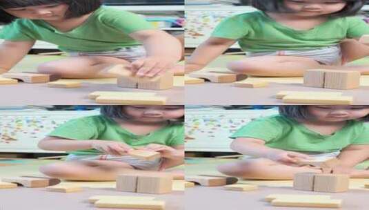 夏天坐在地上玩积木的中国女孩高清在线视频素材下载