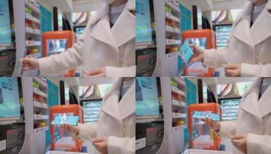 在超市使用手机自助扫码结账的女性高清在线视频素材下载