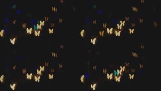闪烁蝴蝶的模糊散景高清在线视频素材下载