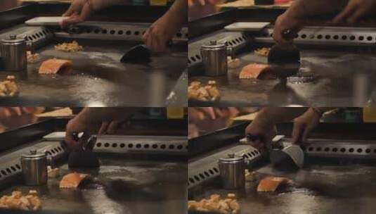 厨师在大炉子上烹饪鱼高清在线视频素材下载