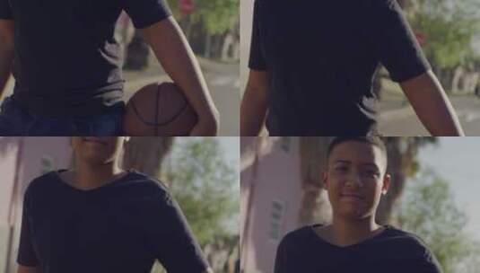 抱着篮球微笑的阳光男孩高清在线视频素材下载