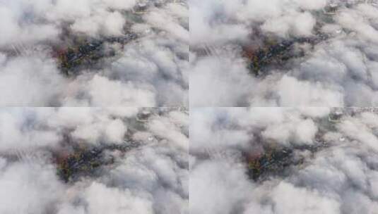 俯瞰云雾中的银杏村落高清在线视频素材下载
