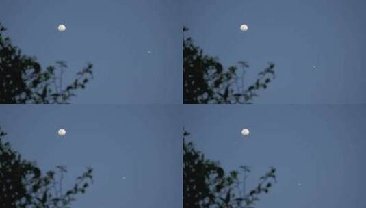蓝天上的月亮和飞过的飞机高清在线视频素材下载