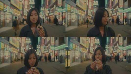 女孩走在都市街头吃东西高清在线视频素材下载