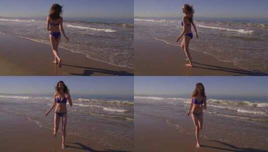 穿比基尼奔跑在沙滩上的女人高清在线视频素材下载