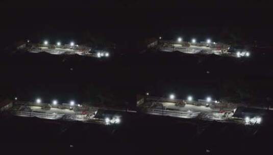 航拍山东省威海市双岛湾公路桥扩建夜间施工高清在线视频素材下载