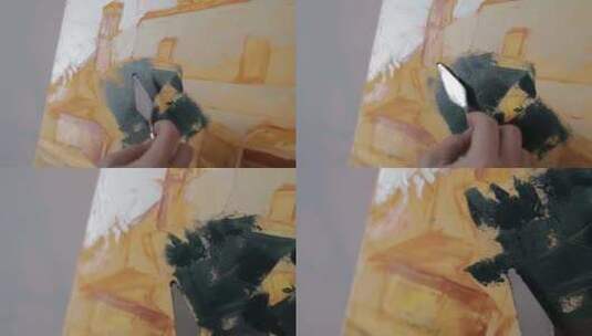 一个在画布上画油画的人高清在线视频素材下载