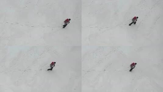 鸟瞰图：人类走过白雪皑皑的沙漠。高清在线视频素材下载