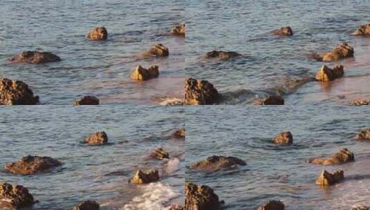 海浪和沙滩上的岩石高清在线视频素材下载