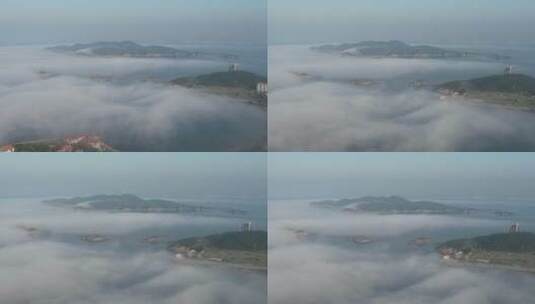 航拍威海市环翠区半月湾刘公岛附近的平流雾高清在线视频素材下载