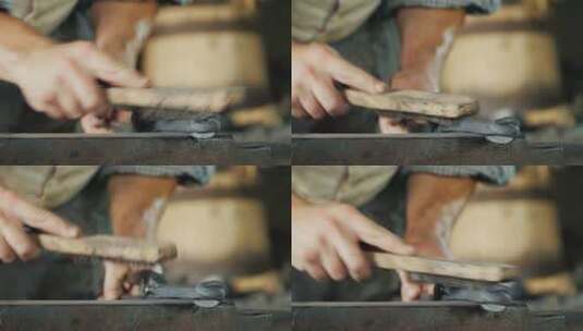 铁匠用铁丝刷子打磨金属材料特写镜头高清在线视频素材下载