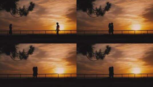 日落时一对情侣接吻的剪影高清在线视频素材下载