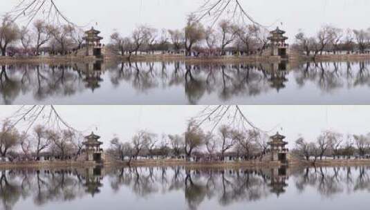 北京颐和园昆明湖水面上映出西堤镜桥高清在线视频素材下载