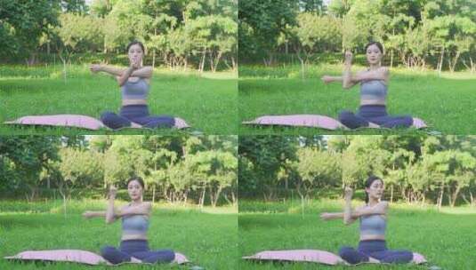 户外草地上做瑜伽的年轻女性身穿运动服装高清在线视频素材下载