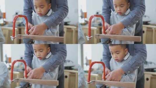小男孩在老师指导下做木工锯木头动手能力高清在线视频素材下载