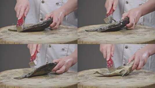 厨师制作清蒸石斑鱼去鳞高清在线视频素材下载
