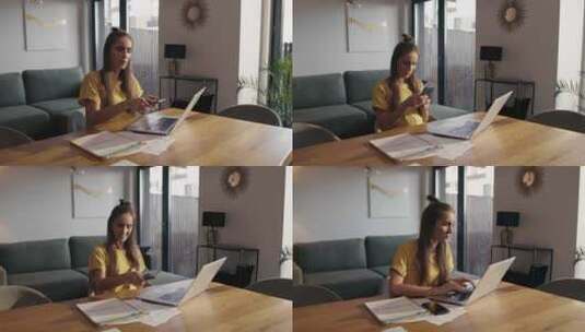 白人妇女坐在办公桌前浏览手机。用红色氦气相机在8K拍摄。高清在线视频素材下载
