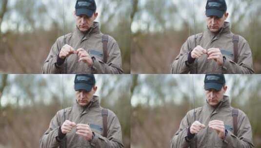 男人将鱼钩从鱼竿上取下来高清在线视频素材下载