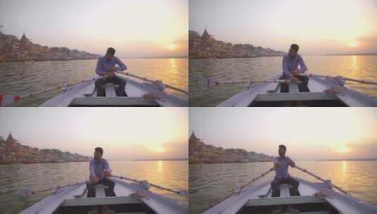 夕阳下男子独自划着一艘船过河高清在线视频素材下载