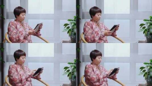 午后坐在阳台看书的中国女性形象高清在线视频素材下载
