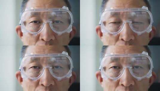 办公室科研实验室戴着护目镜中年男技术人员高清在线视频素材下载